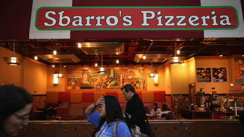 people walking past Sbarro