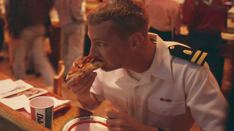 sailor eating Sbarro pizza