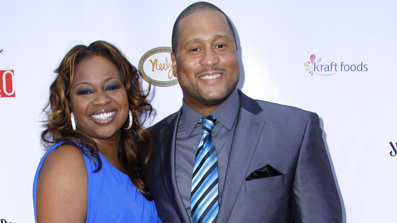 Pat and Gina Neely smiling at camera at an event