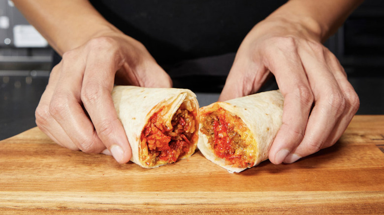 hands displaying flamin' hot burrito
