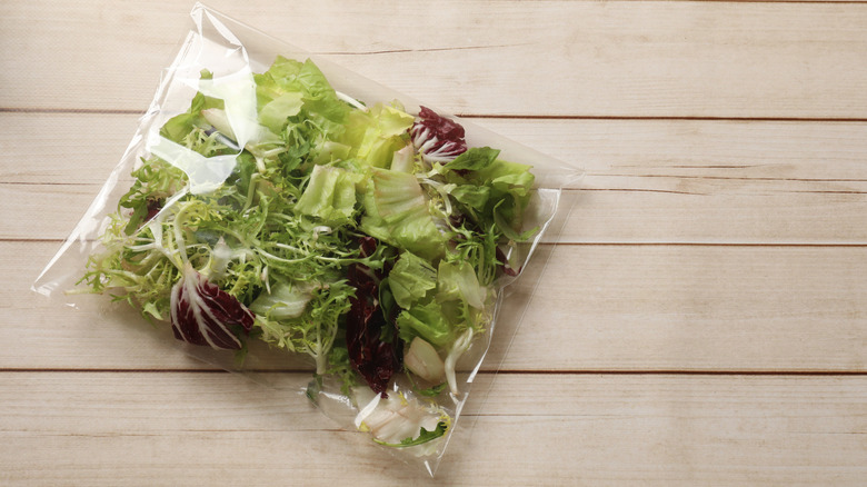 Clear plastic bag of mixed salad greens