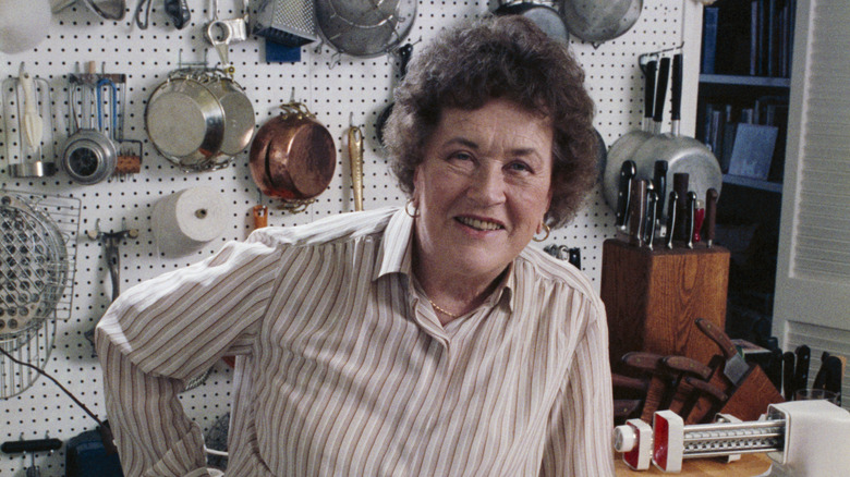 Julia Child smiling in her kitchen