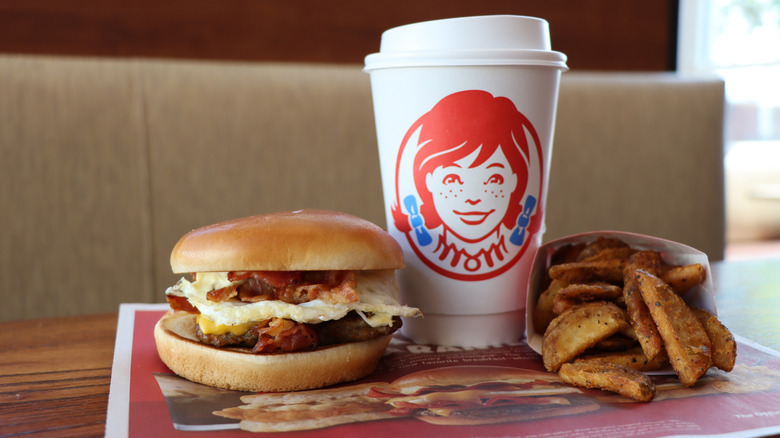 Wendy's breakfast sandwich, coffee, and fried potatoes
