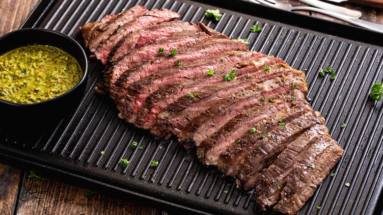 Grilled flank steak with chimichurri and fresh parsley