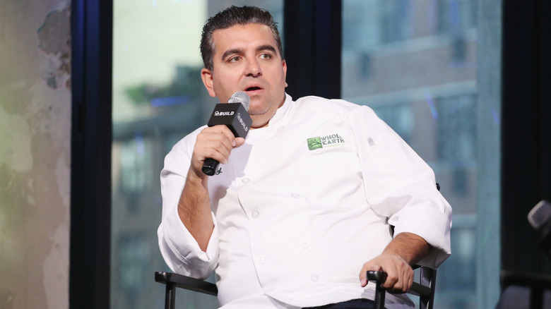 Buddy Valastro sitting in a chair during a Q&A