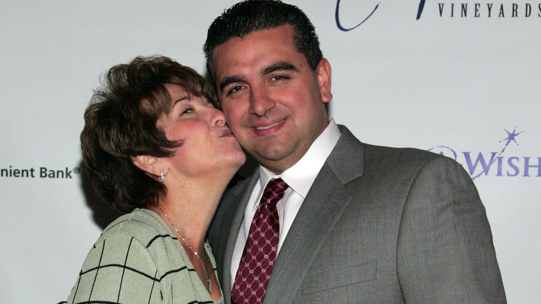 Buddy Valastro and his mother Mary, who's kissing his cheek