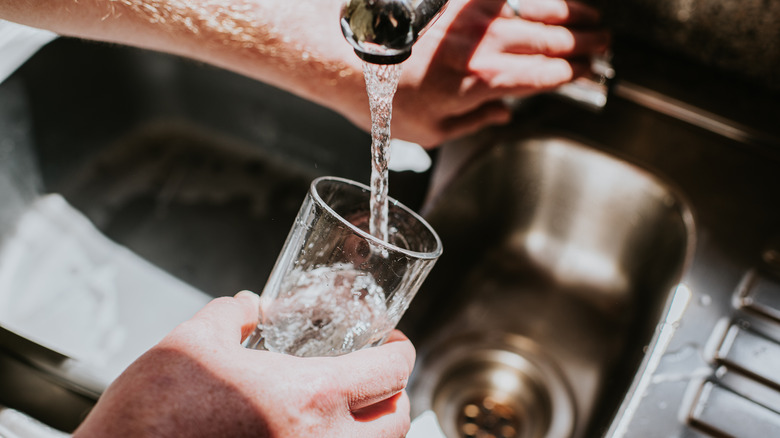 Glass being filled with water