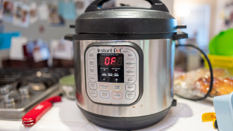 Instant Pot pressure cooker on the counter of a domestic kitchen.