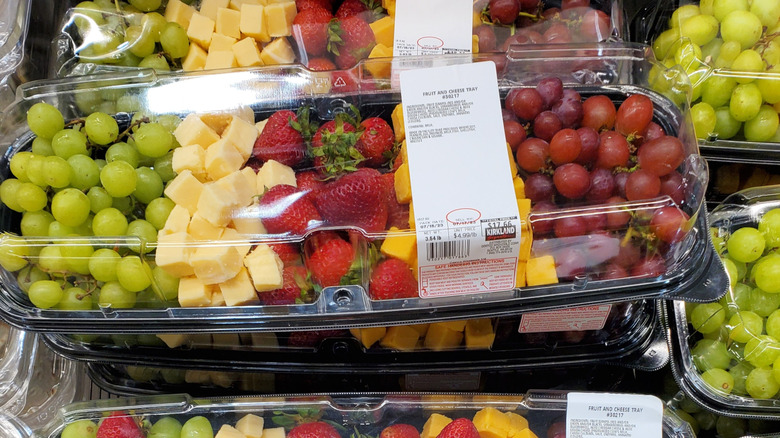 Costco fruit and cheese platters on display in the store