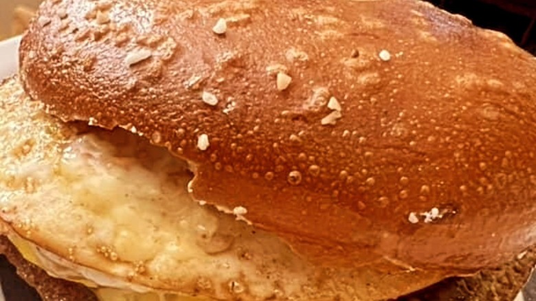 Close-up of a Zagel breakfast sandwich with egg, cheese. and sausage