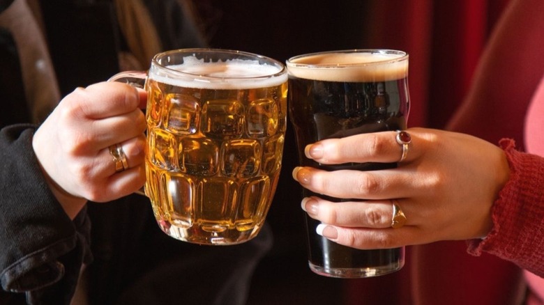 two pubgoers clinking glasses at The Dandelion in Philadelphia