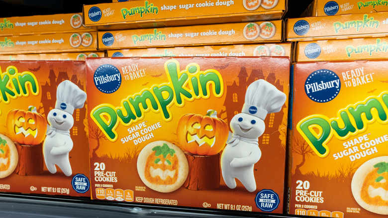 Boxes of Pillsbury Pumpkins sugar cookie dough on grocery store shelf