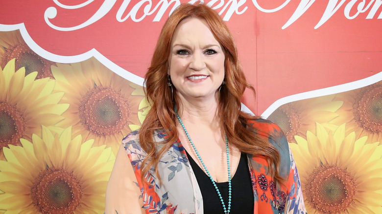 Ree Drummond candid in front of a Pioneer Woman Magazine background