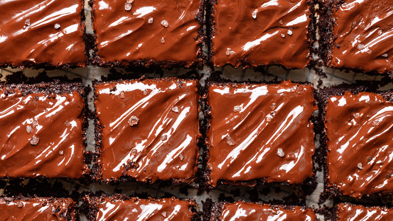 Even square slices of frosted chocolate sheet cake