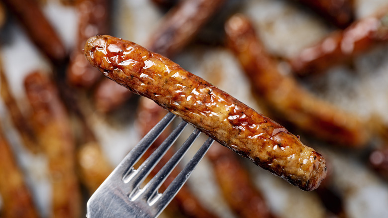 Close-up of a breakfast sausage on a fork