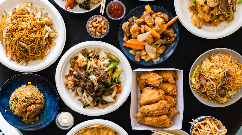 Assortment of Asian foods in takeout containers