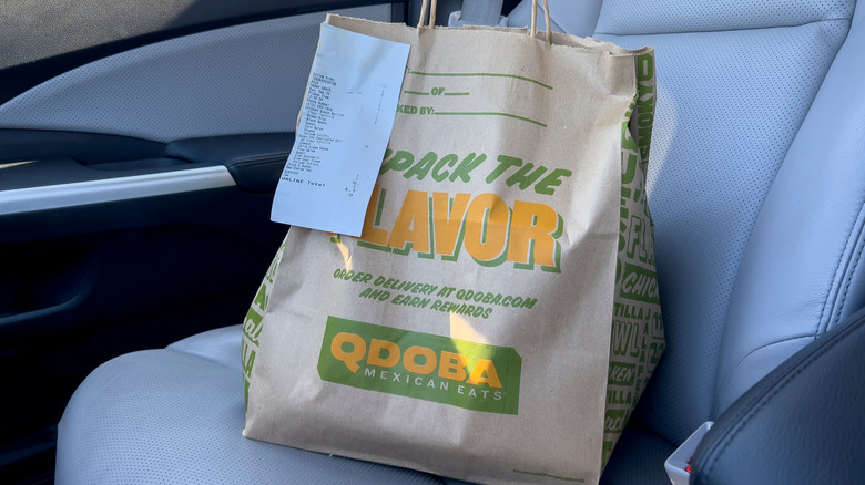 A takeout bag from Qdoba, a Tex-Mex restaurant chain