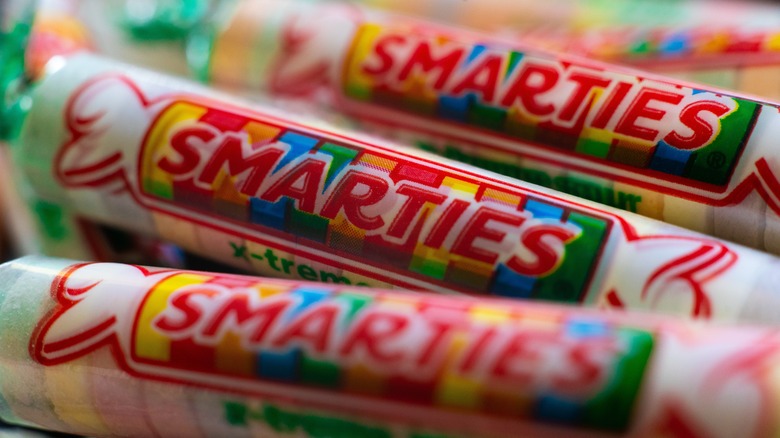 Three rolls of smarties candies