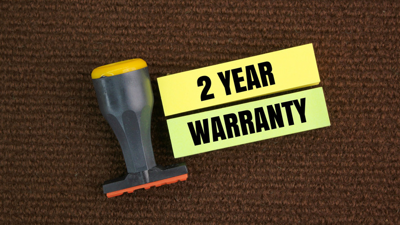 2-year warranty stamps on brown backdrop