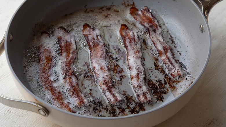 Cooked bacon in large pan