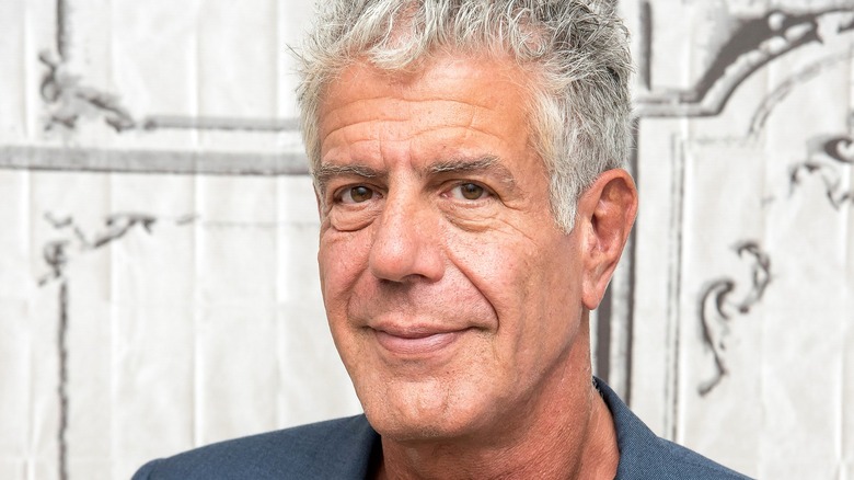 Anthony Bourdain posing for photograph