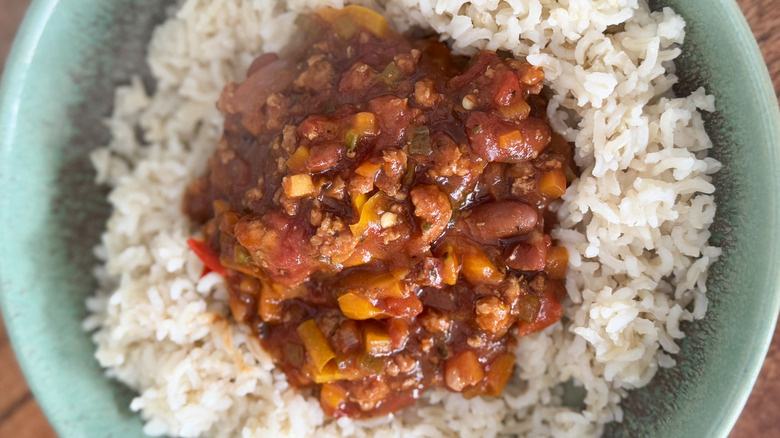 chili on top of a bowl of rice