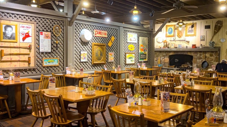 Tables, chairs, and decor inside Cracker Barrel restaurant