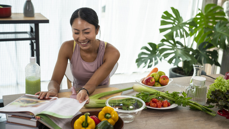 Woman using a cookbook.