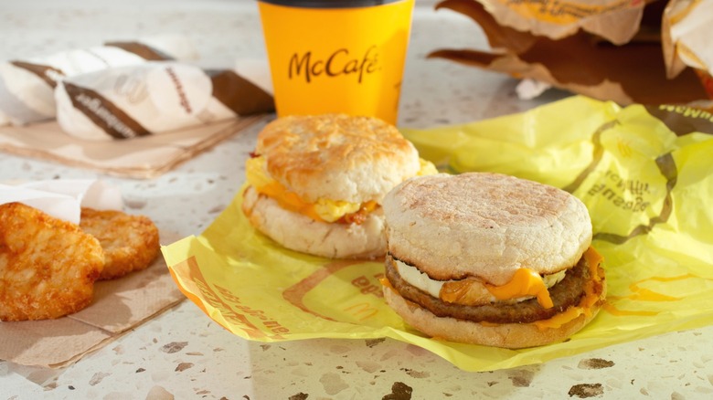 Several McDonald's breakfast items, including Egg McMuffins, hash browns, and coffee.