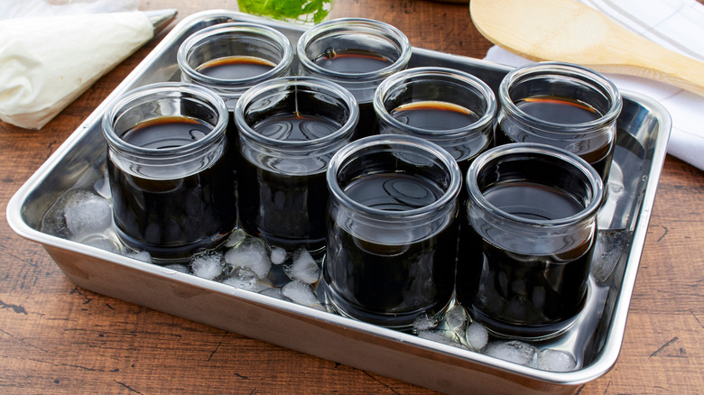 Cups of coffee jelly chill in an ice bath