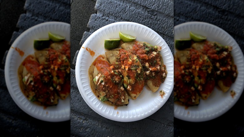 Three Tacos Dorado de Camaron on white styrofoam plate