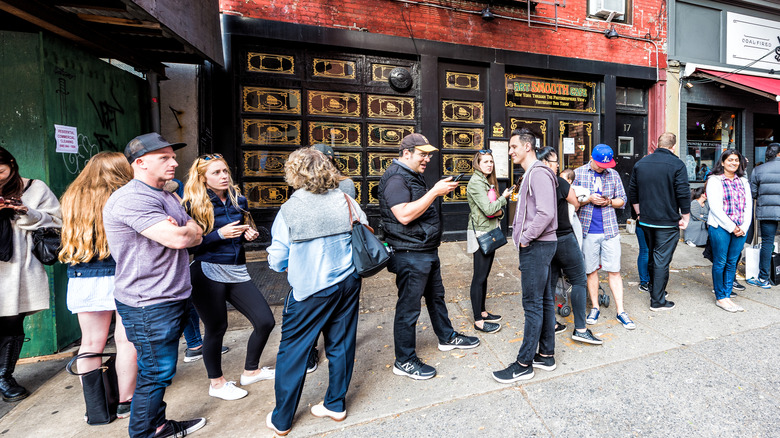 Waiting to get into a pizza place in NYC