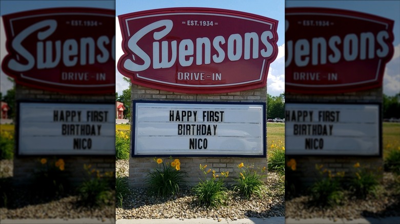 A red and white Swenson's exterior sign; readerboard below reads "Happy first birthday Nico"