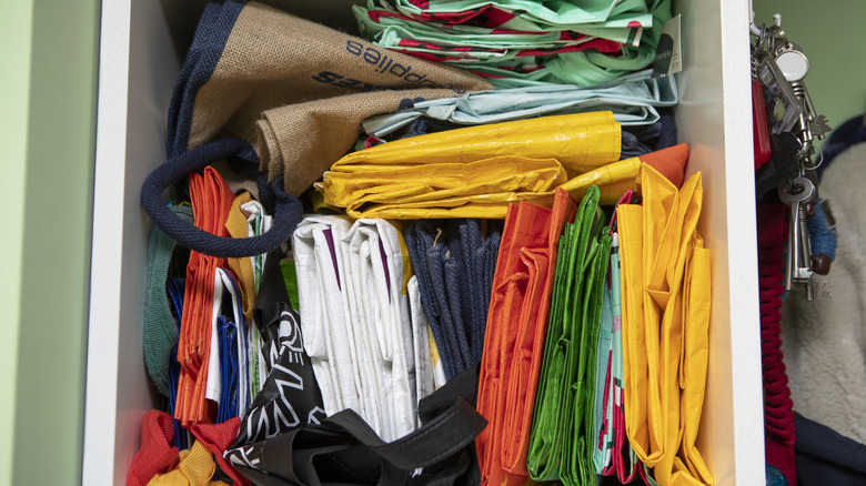 A drawer filled with reusable grocery bags