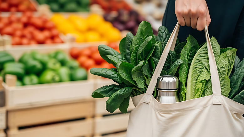 Reusable grocery bag filled with produce