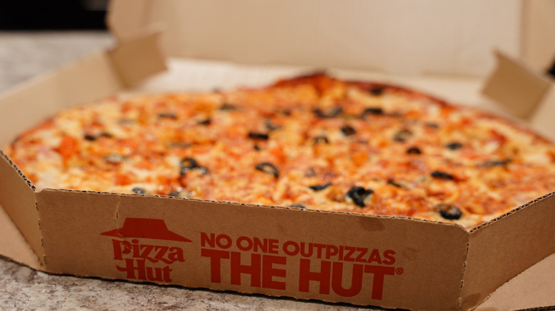 A pizza pie in a box from Pizza Hut
