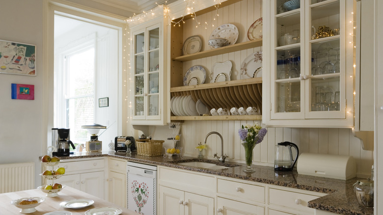 Serveware on display in an off-white kitchen