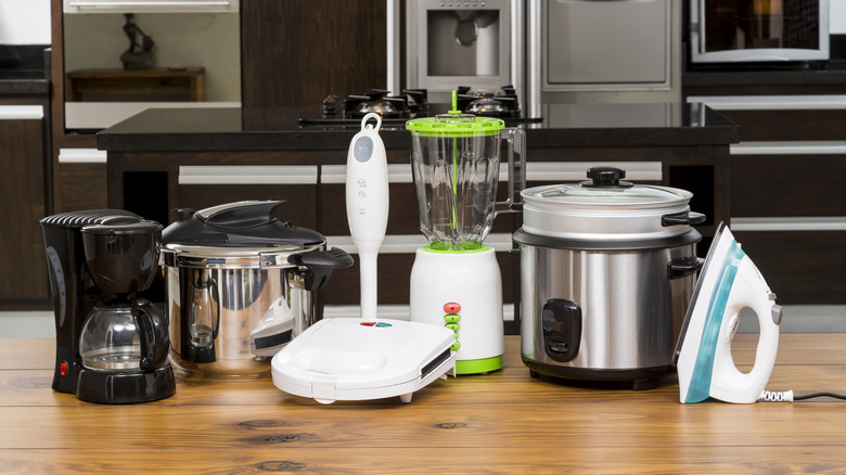 A lineup of appliances on a kitchen counter