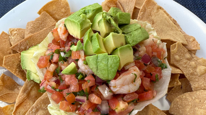 Shrimp ceviche layered over a bed of tortilla chips
