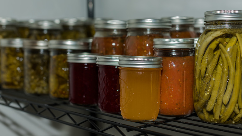 Rows of homemade pickles, jams and sauces.