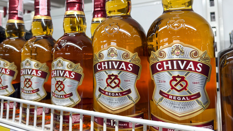 Close-up of bottles of Chivas Regal on a store shelf