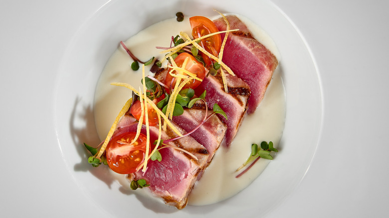 Elegant seared rare tuna in white bowl