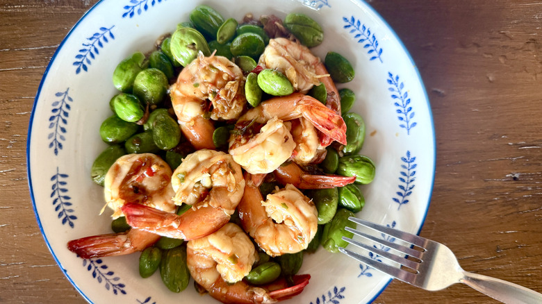Close-up of a bowl of shrimp and beans stir fried with chili
