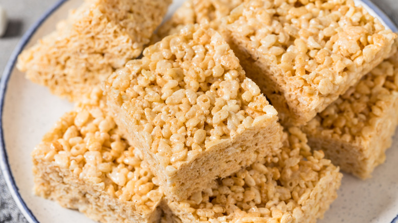 Rice Krispies treat squares on a white plate