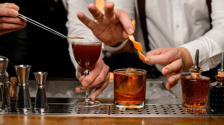 Bartenders making various cocktails