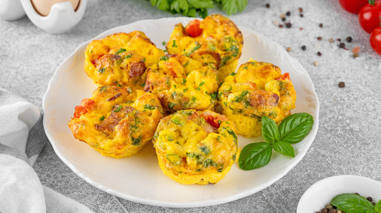 Six fluffy egg bites sit on a plate