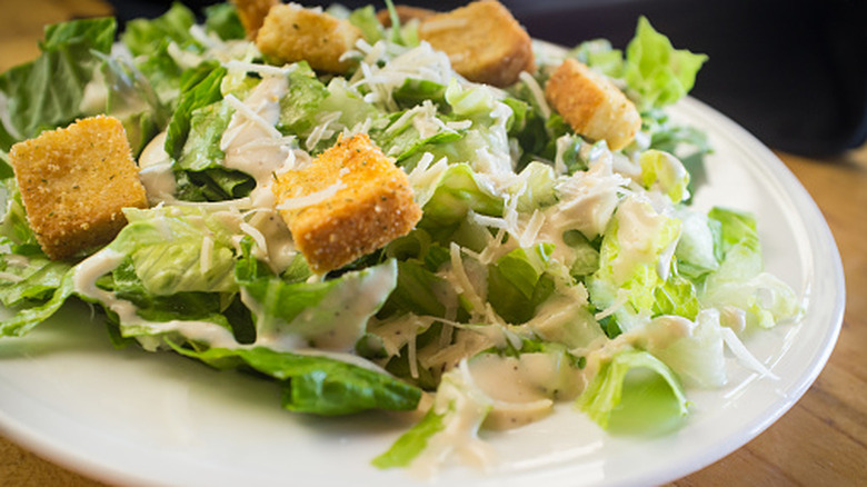 Caesar salad on a dinner plate
