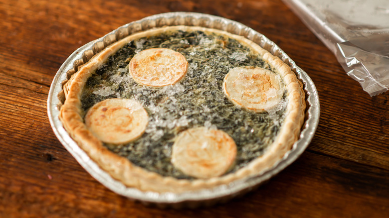 Frozen spinach quiche in a foil pan