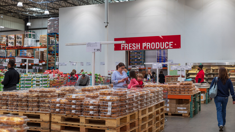 The inside of a Costco store with customers walking around