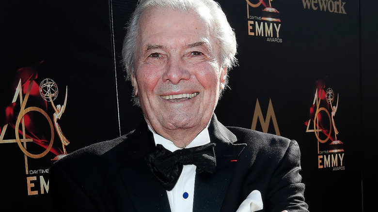 Jacques Pepin smiles in a tuxedo at an event